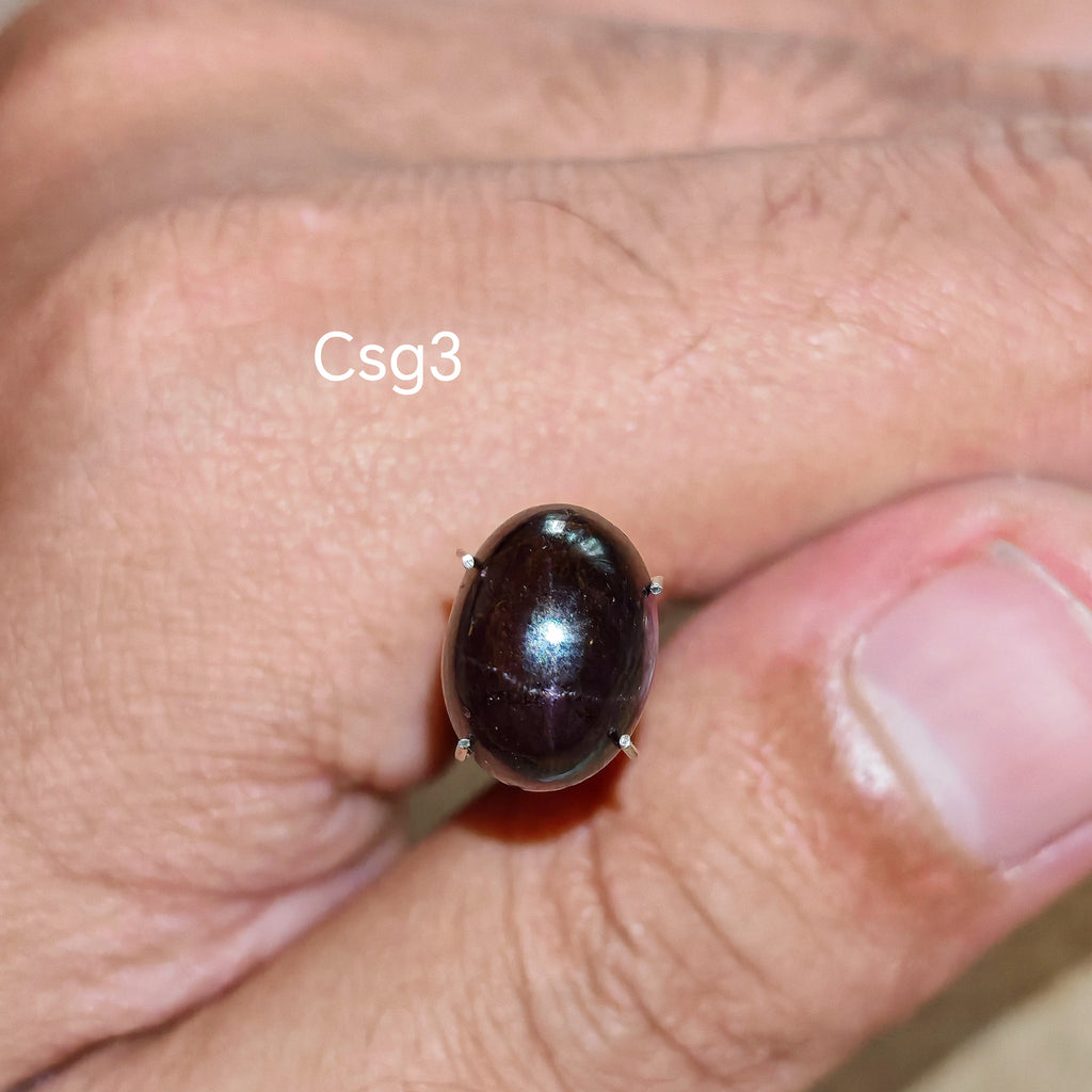 Star Garnet kabochon Csg3 – természetes csillag gránát kabochon közelről, aszterizmus effekt
